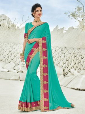 Зелёное шёлковое индийское сари, украшенное вышивкой