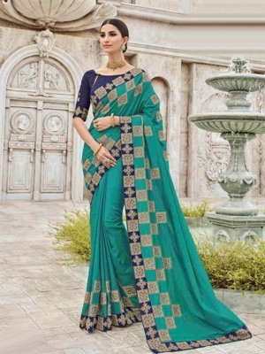 Зелёное шёлковое индийское сари, украшенное вышивкой люрексом