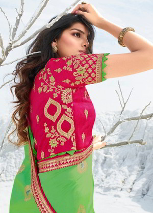Светло-зелёное и цвета фуксии жаккардовое и шёлковое индийское сари, украшенное вышивкой