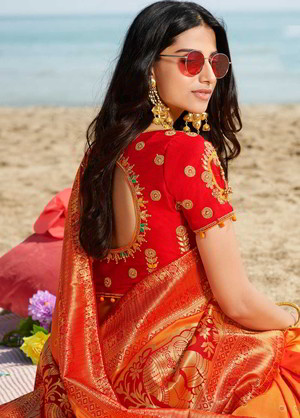 Жёлтое и красное жаккардовое и шёлковое индийское сари, украшенное вышивкой люрексом