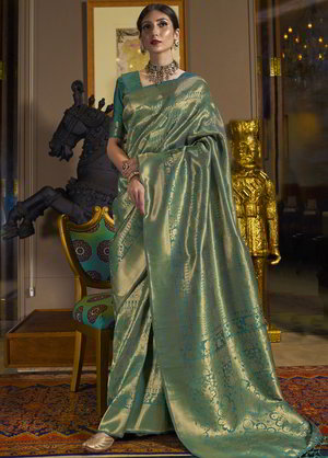 Зелёное жаккардовое и шёлковое индийское сари, украшенное вышивкой люрексом