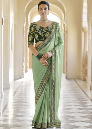 Зелёное индийское сари из органзы и фатина, украшенное вышивкой люрексом, скрученной шёлковой нитью