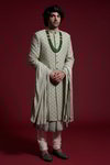 *Зелёный хлопко-шёлковый и шёлковый индийский свадебный мужской костюм / шервани, украшенный вышивкой